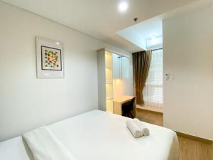 Great Choice and Comfort Stay 2BR at Patraland Urbano Apartment By Travelio