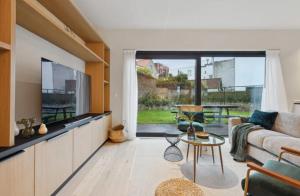 Triton luxe gelijkvloers appartement met tuin en gratis garage