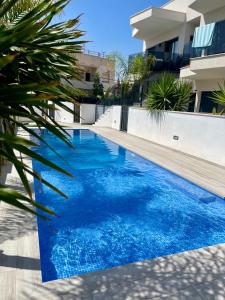 Air-conditioned Elisa Apartment with spacious sunroof lounge and swimming pool