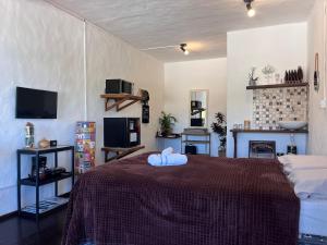 Espaço com Studios Rústicos na Lagoa da Conceição, Ar Condicionado e WiFi