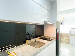 Simply Look Studio Room at Patraland Urbano Apartment By Travelio