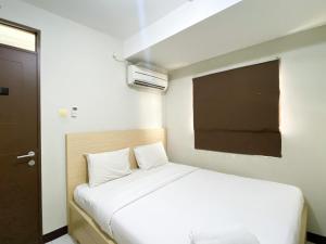 Basic 2BR at Lagoon Bekasi Town Square Apartment By Travelio