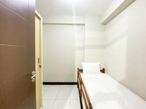 Basic 2BR at Lagoon Bekasi Town Square Apartment By Travelio