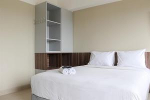 Modern Look and Homey Studio Apartment Gateway Park LRT City Jatibening By Travelio