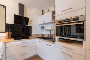 Appartements Le Cocon d-Adamille - Appt avec piscine partagee : photos des chambres