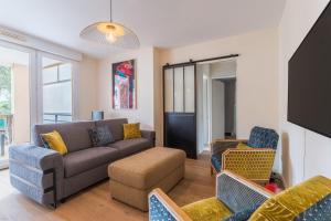 Appartements Le Cocon d-Adamille - Appt avec piscine partagee : photos des chambres