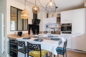 Appartements Le Cocon d-Adamille - Appt avec piscine partagee : photos des chambres