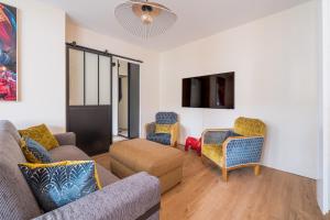 Appartements Le Cocon d-Adamille - Appt avec piscine partagee : photos des chambres
