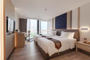 Phòng Hai Giường Đơn Loại Sang (Deluxe Twin Room)