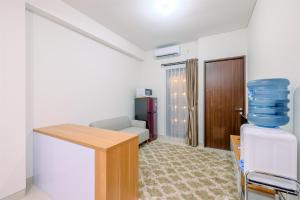 Well Designed 2BR Corner Transpark Cibubur Apartment By Travelio