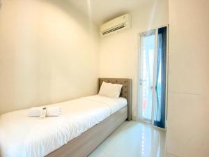 Fancy and Nice 3BR at Grand Kamala Lagoon Apartment By Travelio