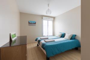 Appartements T2 lumineux, a 10 min de Disney, au pied de la gare avec parking prive : photos des chambres