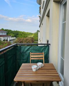 Appartements T2 lumineux, a 10 min de Disney, au pied de la gare avec parking prive : photos des chambres