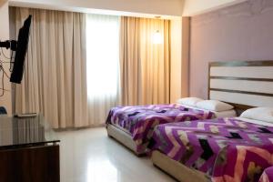 Infinity Suites Habitación Triple 203