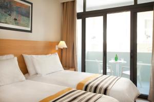 Double or Twin Room with Balcony room in The Preluna Hotel