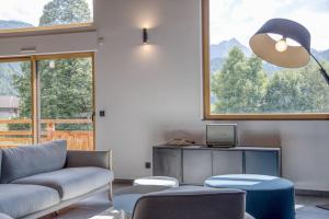 Chalets Chalet mitoyen - Jacuzzi - Cousinade I : photos des chambres