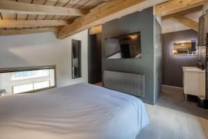 Chalets Chalet mitoyen - Jacuzzi - Cousinade I : photos des chambres