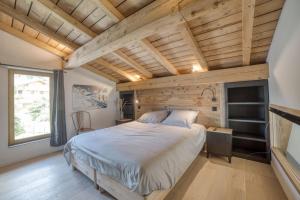 Chalets Chalet mitoyen - Jacuzzi - Cousinade I : photos des chambres