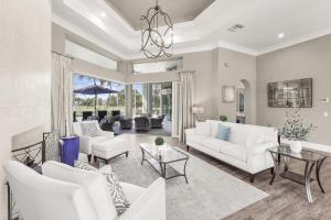 Opulent golf front home with SW-facing lanai and pool