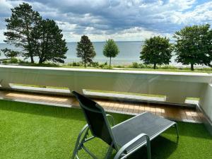 FeWo Traumblick - Küstenklang erste Reihe mit TRAUM Meerblick aus dem Bett