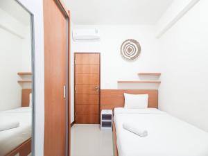 Spacious and Comfortable 3BR Vida View Makassar Apartment By Travelio