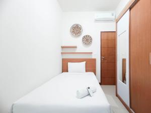 Spacious and Comfortable 3BR Vida View Makassar Apartment By Travelio