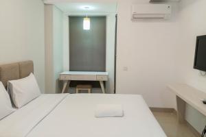 Cozy Studio at Barsa City Apartment By Travelio