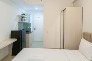 Cozy Studio at Barsa City Apartment By Travelio