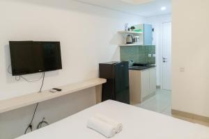 Cozy Studio at Barsa City Apartment By Travelio