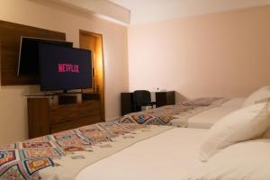 Infinity Suites triple room 211