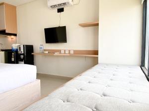 Simply Look Studio at Pollux Chadstone Apartment By Travelio