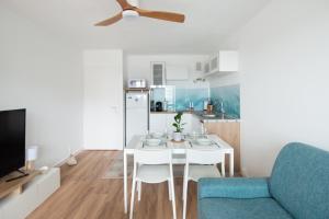 Appartements Face a Juno Beach - Appartement vue mer et port : photos des chambres