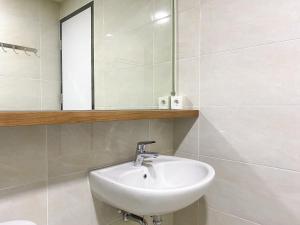 Good and Homey 1BR Apartment at Mustika Golf Residence By Travelio