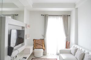 Modern and Homey 2BR at Signature Park Grande Apartment By Travelio