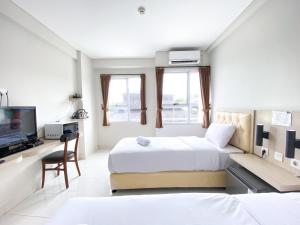Good Choice and Comfy Studio (No Kitchen) at Elvis Tower Apartment By Travelio
