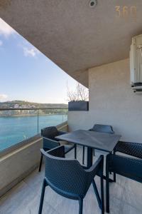 Waterfront 3BR home, with private balcony in Xemxija by 360 Estates