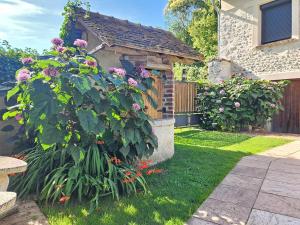 Maison de charme à Sainte-Geneviève-lès-Gasny avec jardin