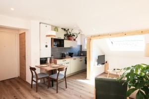 Appartements En plein centre du village ! : photos des chambres