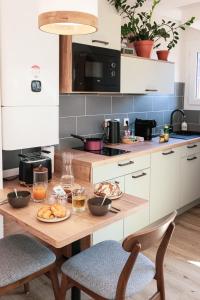 Appartements En plein centre du village ! : photos des chambres