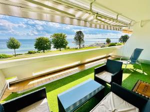 FeWo Traumblick - Küstenklang erste Reihe mit TRAUM Meerblick aus dem Bett