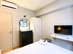 Cozy Designed 2BR with Working Room at Meikarta Apartment By Travelio