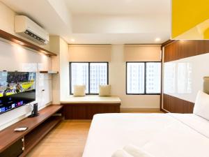 Homey Stay Studio at Pollux Chadstone Apartment By Travelio