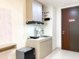 Homey Studio at Pollux Chadstone Apartment By Travelio