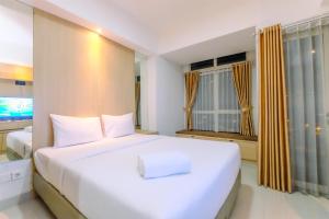 Best Deal and Cozy Studio Oasis Cikarang Apartment By Travelio