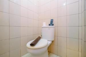 Minimalist Studio with Great City View at Tifolia Apartment By Travelio