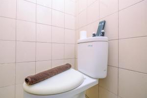 Minimalist Studio with Great City View at Tifolia Apartment By Travelio