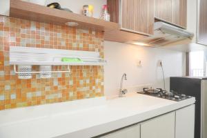 Comfort Living and Homey Studio Signature Park Grande Apartment By Travelio