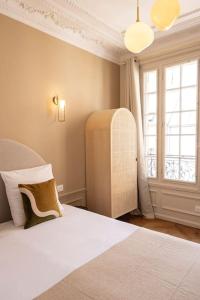 Appartements Paisible Appartement a Deux Pas de Paris : photos des chambres