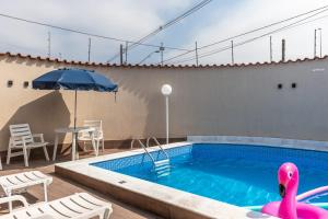 Casa Lindíssima e Espaçosa com 2 Piscinas - Adulto e Infantil, Perto da Praia, Opção da Piscina Adulto Aquecida Cobrado à Parte, 4 Quartos Frente as Piscinas, Área Gourmet Completa com Churrasqueira, Forno e Fogão a Lenha, Mesa de Bilhar, Lare