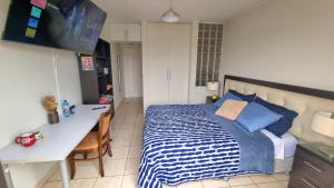 Habitación en casa de Luis con espacios compartidos